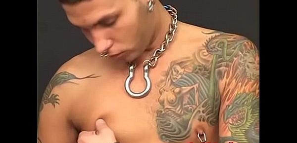  Young biker with tatts and piercings plays with his feet